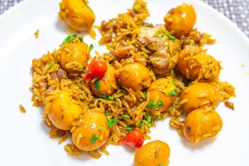 Traditional Goiana chicken stew, rice with pequi fruit. An iconic recipe from central Brazil. Pimenta biquinho