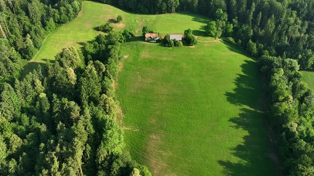 Drone view Drava riverside hills in summer, Gortina village, deep green forest on hills near river.