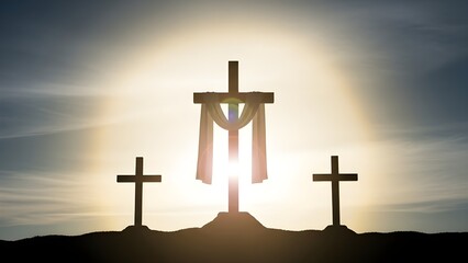 Three crosses on a hill at sunset