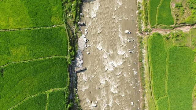 Aerial Drone View of Nuwakot Valley with a Beautiful River Along Hills and Paddy Fields