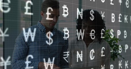 Examining tablet, man in blue shirt and woman in light blouse viewing currency symbols in office