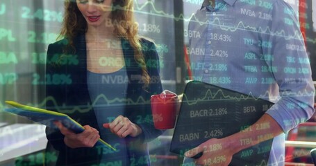 Reviewing duo in work attire studying market overlay at office, with yellow folder, laptop, red mug