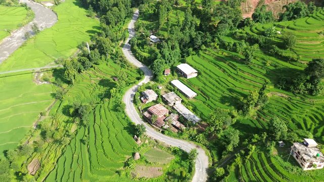 Aerial Drone View of Nuwakot Valley with a Beautiful Road Along Hills and Paddy Fields