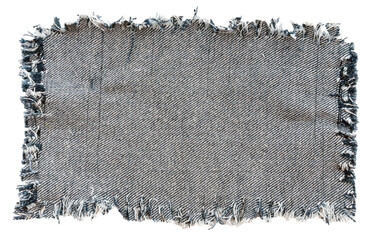 Piece of torn denim on a white background. Denim texture