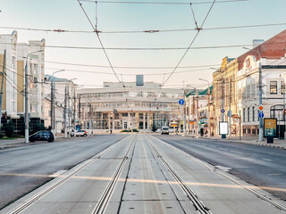 Sovetskaya street in Tula, Russia. An urban landscape with tram tracks and a contact network above the road in the early morning