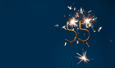 55 years anniversary festive background made with Bengal fires in the form of number Fifty five.
