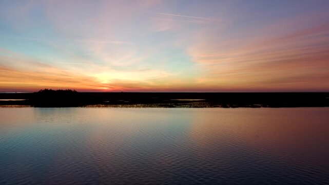 Drone clip of slow ascension over the intercostal waterway in South Carolina just before sunrise.