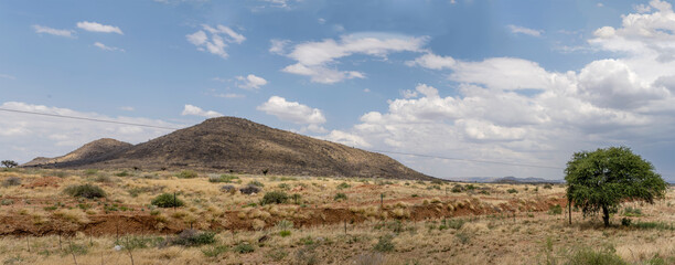 lone hill in green country landscape near Elizenhohe, Namibia