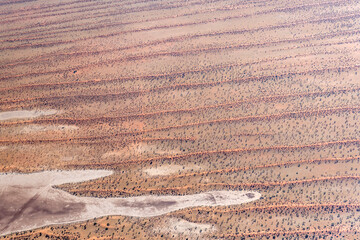 Kalahari  red dunes bulging into pan, near Intu Africa game farm, Namibia
