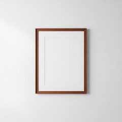 Obraz premium Classic wooden brown picture frame mockup on a white wall for artwork or photography presentation