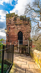 A view towards a defensive fortification on the city walls walkway in the city of Chester, Cheshire, UK