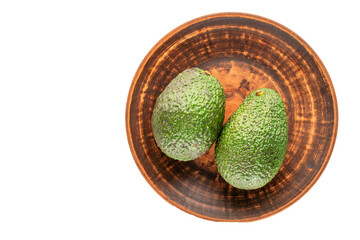 Ripe avocado isolated on white background, close-up, top view.