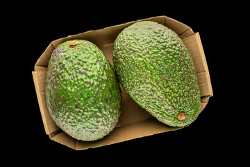 Ripe avocado isolated on black background, close-up, top view.