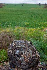 shredded and pressed recyclable plastic waste that has been burned and causes environmental pollution.