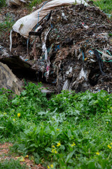 shredded and pressed recyclable plastic waste that has been burned and causes environmental pollution.