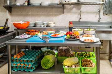 Commercial kitchen preparing chinese peruvian fusion cuisine dishes