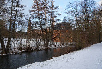 Weimar, Germany, Town castle tower and buildings, view from the snow covered park