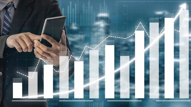A businessman analyzes financial growth trends using a smartphone, surrounded by digital graphs representing success and future profitability. Copula - Powered by Adobe