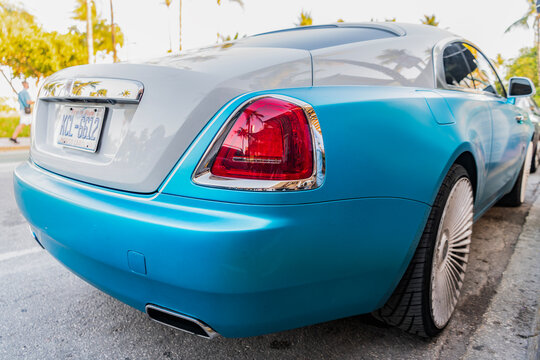 Miami, Florida, USA - April 08, 2025: Rolls Royce Wraith luxury grand tourer car. Grand tourer car Rolls Royce Wraith. Car Rolls Royce Wraith parked outdoor. White blue car, corner view
