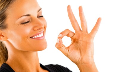 Woman smiles and shows hand gesture indicating satisfaction and approval
