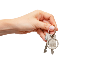 Woman holding keys with house shaped keychain