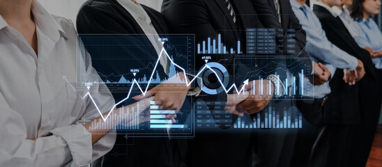 A professional business team stands in line, showcasing digital graphs and data visualizations that represent growth and success in a corporate setting. Scalp