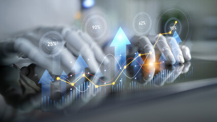 Hands interact with a tablet displaying glowing graphs and data visualizations, symbolizing positive growth trends and metrics in a digital business environment. Scalp
