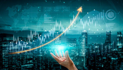 A concept image depicting a hand reaching for a rising financial graph against a modern city...