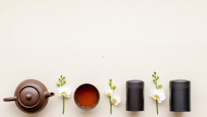 Modern Qingming festival background with minimal beige copyspace background and tea ceremony elements. Calm spring design background with space for text