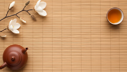 Traditional bamboo mat featuring Qingming festival background with teapot and magnolia, diagonal tea culture design with copy space