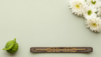 Zen floral layout featuring Qingming festival background with pleated dumpling and incense, minimalist spring culture design with copy space