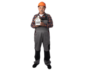 Construction worker holding a house model and a key