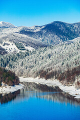 Obraz premium Winter in Croatia. Lokvarsko lake and Risnjak mountain in Gorski kotar.