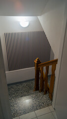 Granite staircase. Light on the staircase landing