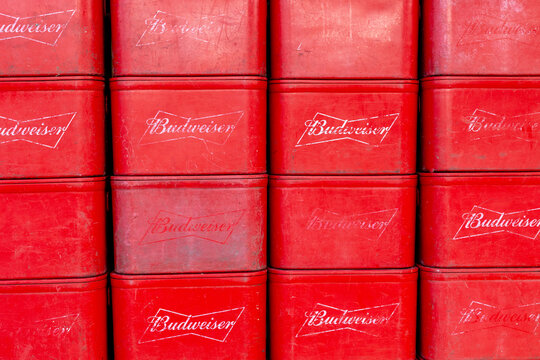 DA NANG, VIETNAM - JANUARY 3, 2026: Stacked red budweiser crates with logos in neat rows