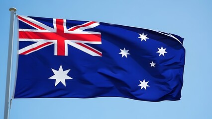 Waving australian national flag against a clear blue sky, symbolizing patriotism and the commonwealth nation