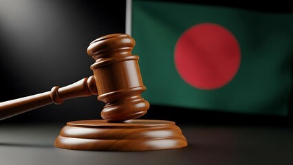Wooden gavel and sounding block in front of blurred flag of bangladesh symbolizing justice and law in the country
