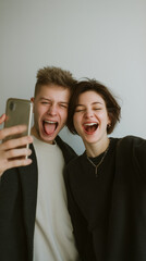 couple taking playful photos of each other on a phone