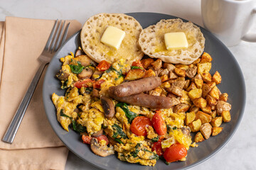 scramble eggs  with breakfast sausages and home fries