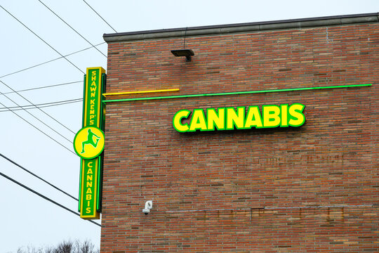 Seattle - December 13, 2025; Shawn Kemp Cannabis sign and logo on wall of  red brick building