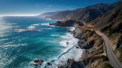 Scenic coastal highway winding through rugged cliffs and ocean waves