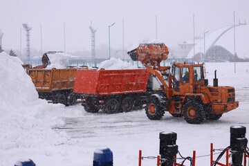 Heavy Equipment Clearing Snow from an Outdoor Area