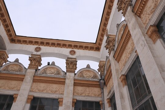 Soviet neoclassical architecture with Corinthian columns and hammer and sickle reliefs