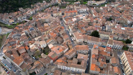 Fototapeta premium Aerial view around the old town of the city Lodève in France on a sunny day in early spring