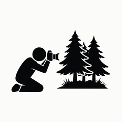 Photographer capturing forest scene