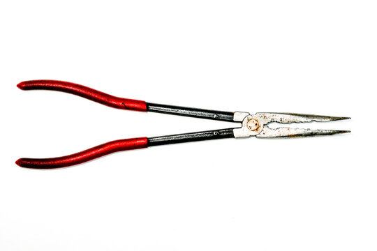 Long nose pliers with red handles isolated on white background, hand tool for precision work