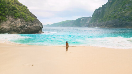 Solo Woman On Secluded Turquoise Bay Beach In Bali Indonesia Paradise Coast