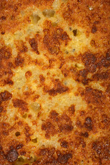 A detailed macro shot capturing the crispy golden brown texture and porous surface of a delicious homemade fried French toast