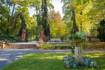 Sunny golden autumn in Wilanow park in Warsaw, Poland. Royal polish residence park in autumn, museum under an open sky without people