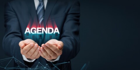 Agenda for Business Meeting. Holding a digital device displaying AGENDA symbolizing structured meeting planning, clear objectives, collaboration and efficient decision making in corporate setting. 